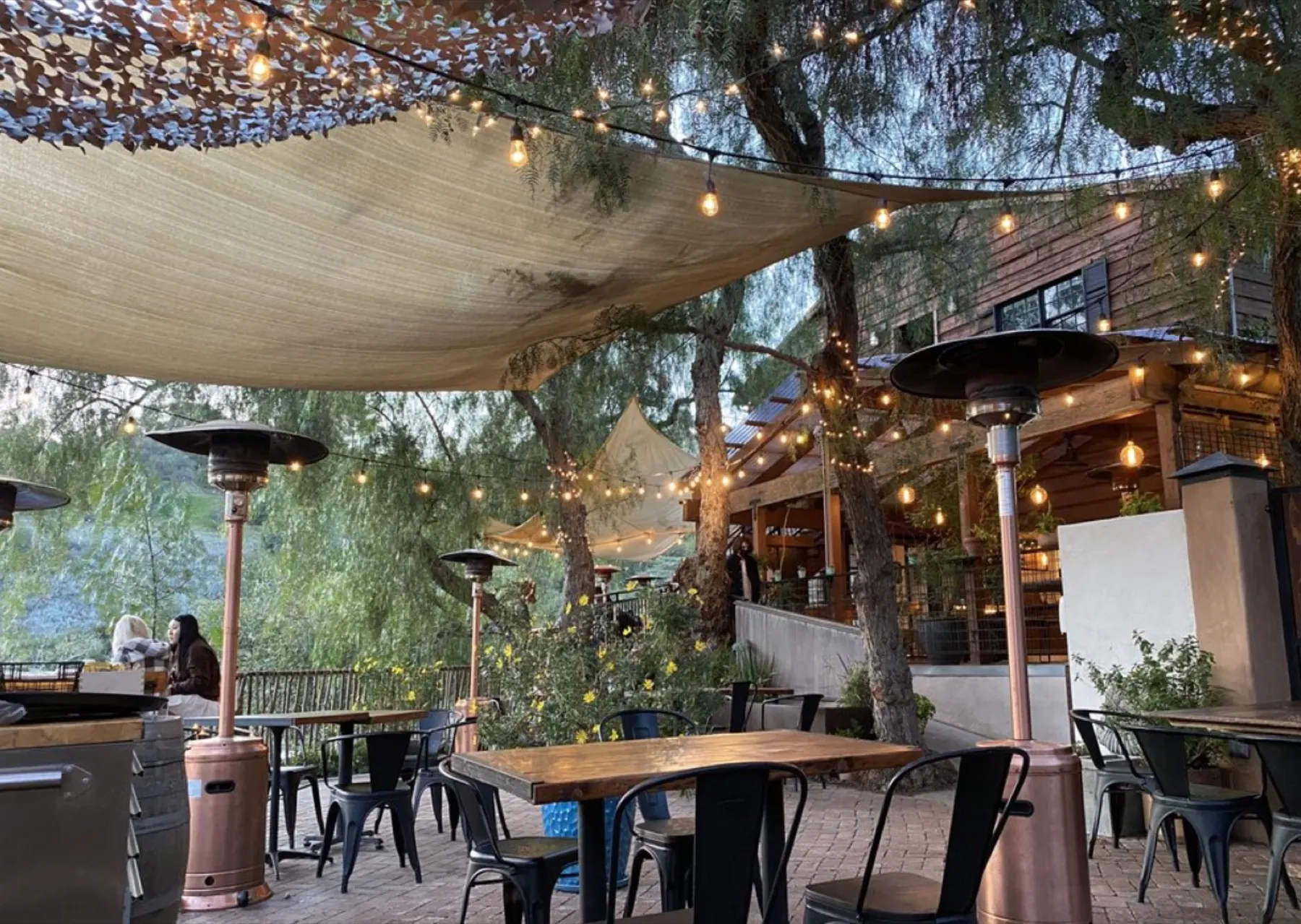 Café on 27 patio glowing at sunset